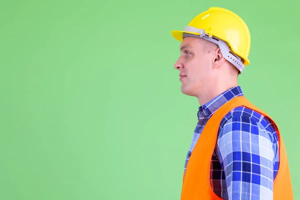 Closeup profile view of young man construction worker — Stock Photo, Image