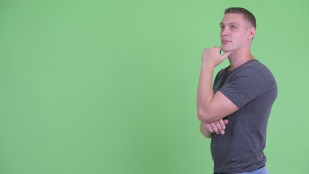 Profile view of happy young man thinking — Stock Video