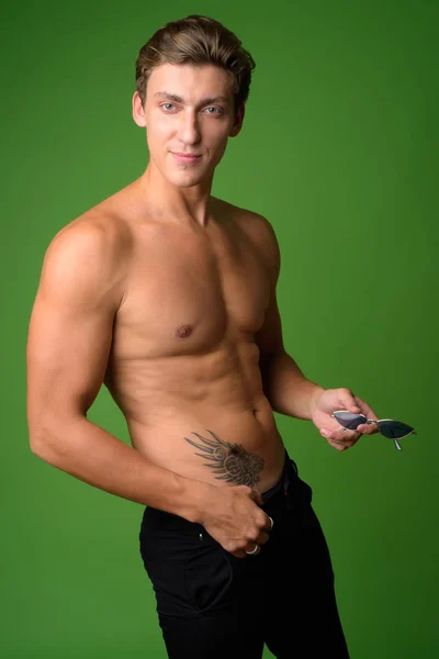 Young handsome shirtless man looking at camera — Stock Photo, Image