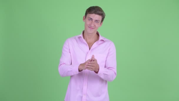 Happy young handsome businessman clapping hands — Stock Video