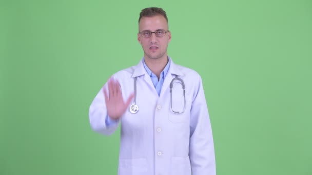 Serious man doctor with stop gesture — Stock Video