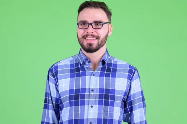 Gezicht van Happy Young bebaarde hipster man denken — Stockfoto