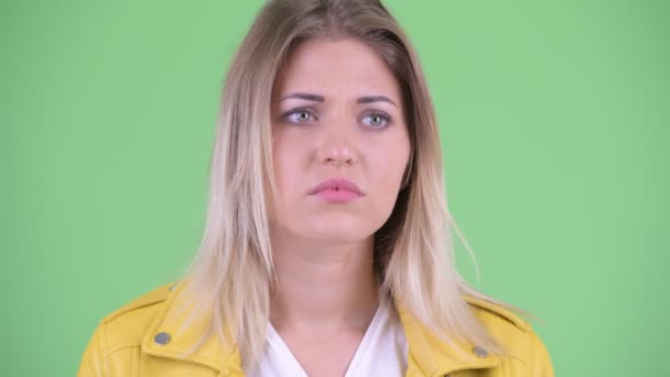 Face of stressed young rebellious blonde woman looking sad and crying — Stock Video