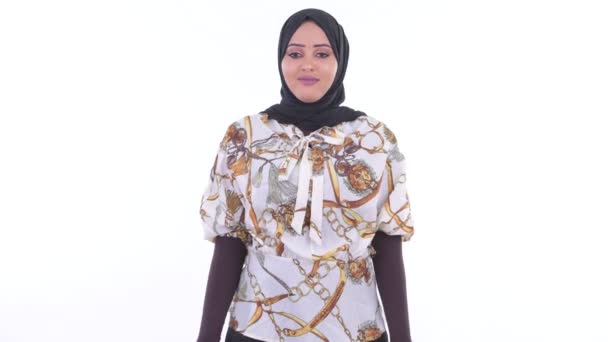 Happy young beautiful African Muslim woman smiling with arms crossed — Stok Video