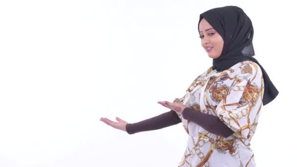 Happy young African Muslim woman showed to the back and giving thumbs up — Stok Video