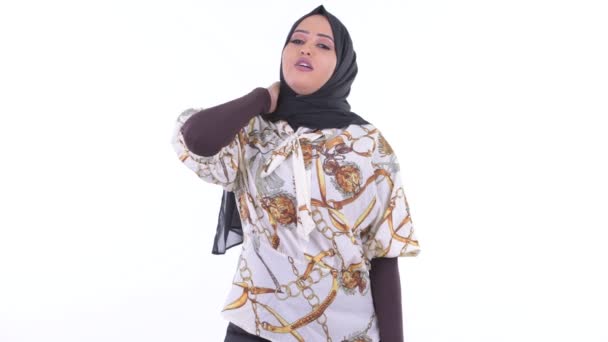 Stressed young African Muslim woman having neck pain — Stock Video