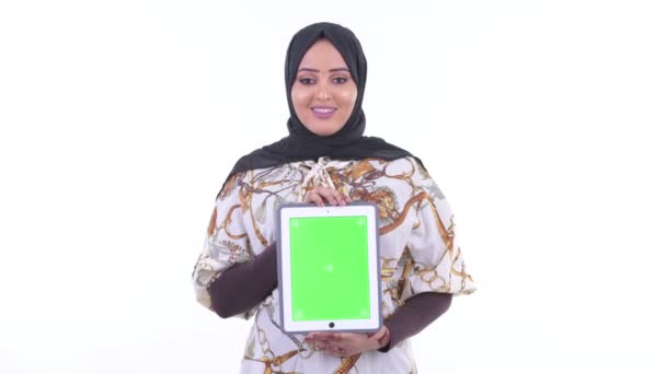 Happy young African Muslim woman showing digital tablet — Stock Video