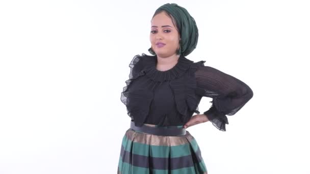 Stressed young African Muslim woman having back pain — Stock Video