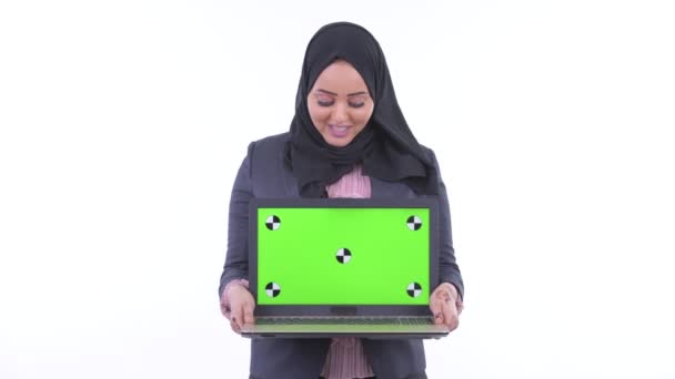 Happy young African Muslim businesswoman talking while showing laptop — Stock Video