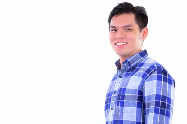 Closeup profile view of happy young Asian hipster man looking at camera — Stock Photo, Image