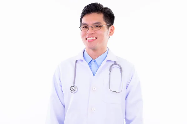 Feliz jovem bonito asiático homem médico pensando — Fotografia de Stock