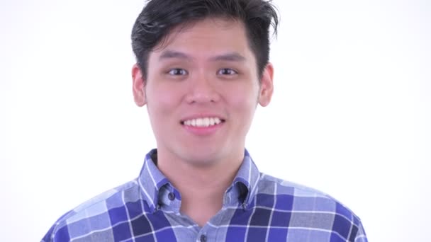 Обличчя щасливих молодих азіатських хіпстера людина киваючи головою так — стокове відео