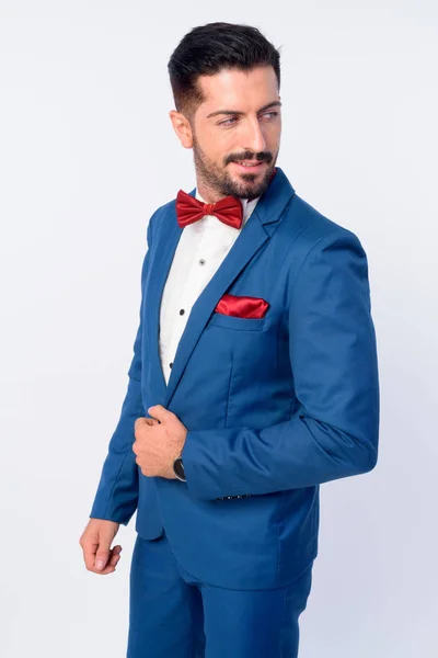青いスーツを着た若いハンサムなひげのビジネスマンの肖像 — ストック写真
