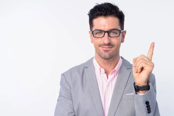 Rostro de joven hombre de negocios guapo con gafas apuntando hacia arriba —  Fotos de Stock