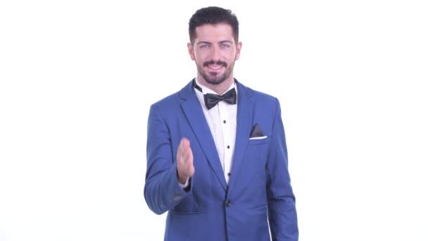 Happy young handsome bearded businessman giving handshake — Stock Video