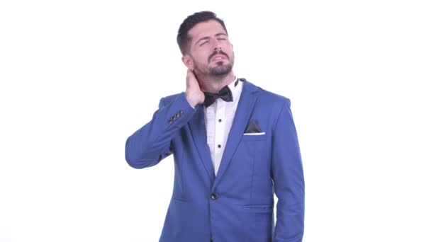 Stressed young bearded businessman having neck pain — Stock Video