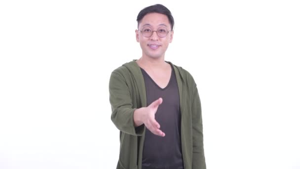 Boldog japán ember szemüvegek, hogy a kézfogás — Stock videók