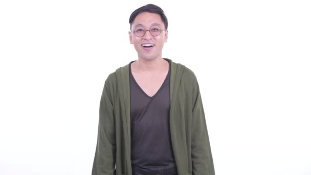 Happy Japanese man with eyeglasses presenting something — Stockvideo