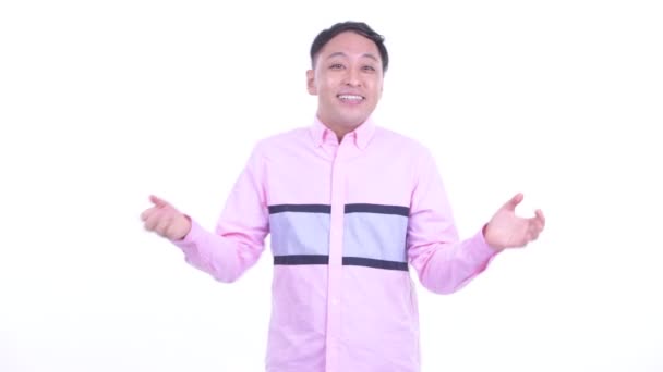 Gelukkige Japanse zakenman met verrassings gebaar — Stockvideo
