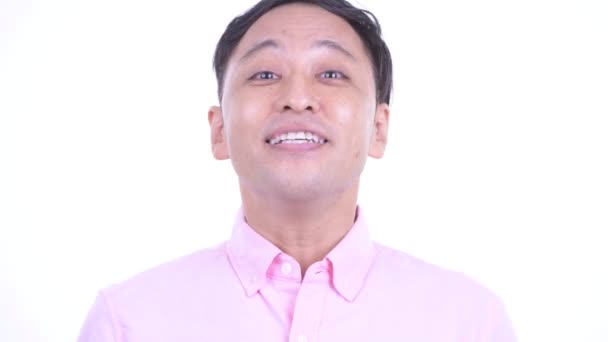 Πρόσωπο του ευτυχισμένο ιαπωνικό επιχειρηματία νεύμα κεφάλι Ναι — Αρχείο Βίντεο
