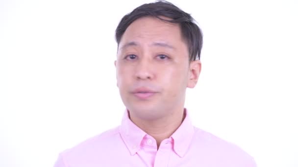 Gezicht van ernstige Japanse zakenman knikkend hoofd Nee — Stockvideo