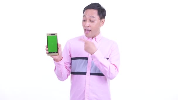 Happy Japanese businessman showing phone and giving thumbs up — Stock Video