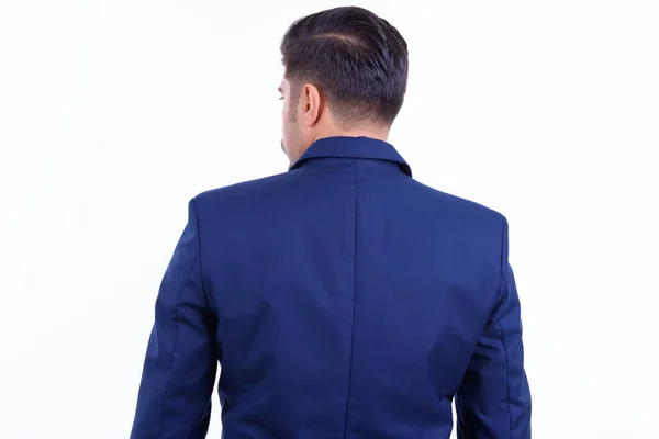 Vista posteriore di uomo d'affari persiano barbuto guardando oltre la spalla — Foto Stock