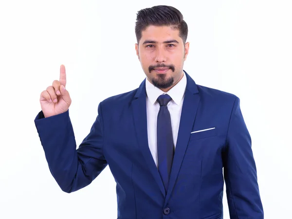 Stilig skäggiga Persiska affärsman i kostym pekar uppåt — Stockfoto