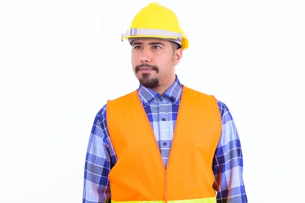 Barbudo hombre persa trabajador de la construcción pensando y mirando hacia otro lado —  Fotos de Stock