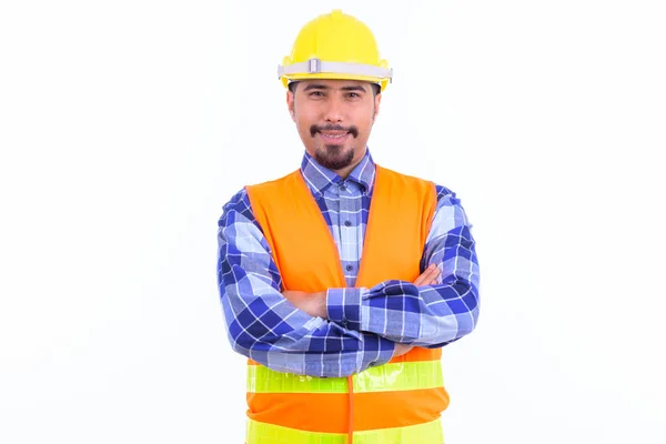 Feliz barbudo Persa obrero de la construcción sonriendo con los brazos cruzados — Foto de Stock