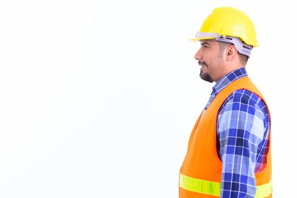 Perfil vista de feliz barbudo hombre persa trabajador de la construcción sonriendo —  Fotos de Stock