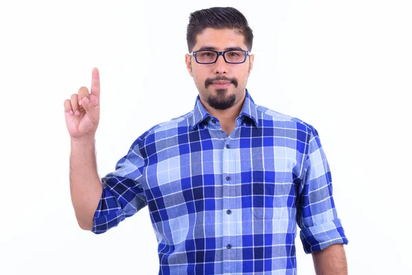 Knappe bebaarde Perzische hipster man naar boven wijzend — Stockfoto