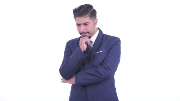 Stressed bearded Persian businessman thinking — Stock Video