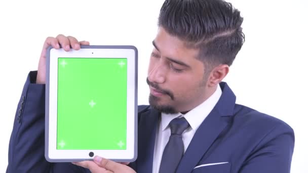 Face of happy bearded Persian businessman showing digital tablet — Stock Video