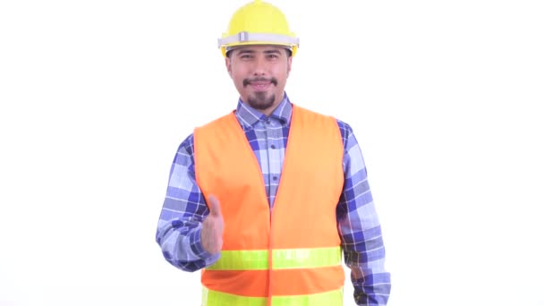 Mutlu sakallı Pers adam inşaat işçisi el sıkışma veren — Stok video