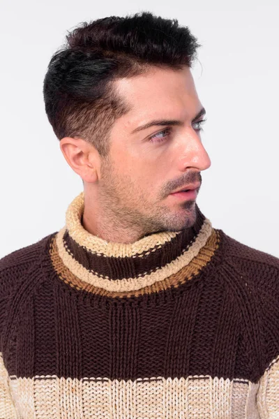 Face of handsome bearded man thinking and looking away ready for winter — Stock Photo, Image