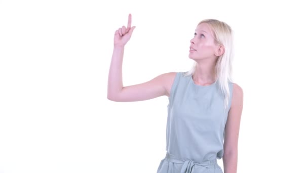 Stressed young blonde woman thinking and pointing up — Stock Video