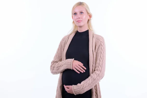 Jonge mooie blonde zwangere vrouw denken en opzoeken — Stockfoto