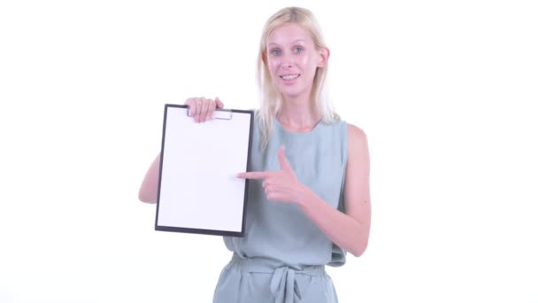 Happy young blonde woman showing clipboard and giving thumbs up — Stock Video