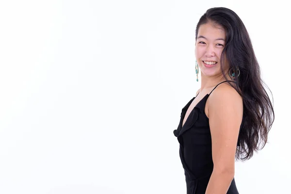 Perfil vista de feliz hermosa mujer asiática mirando a la cámara listo para la fiesta —  Fotos de Stock