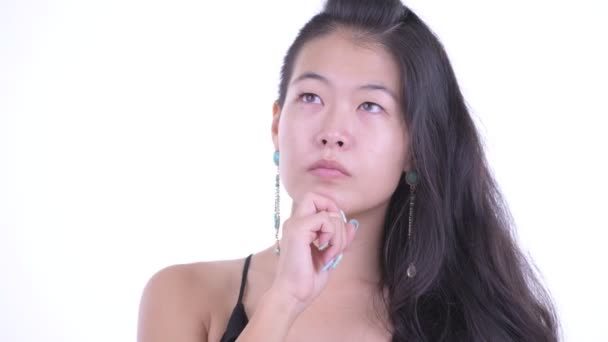 Face of happy beautiful Asian woman thinking and looking up — Stock Video