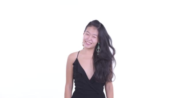 Happy beautiful Asian woman catching something — Stock Video