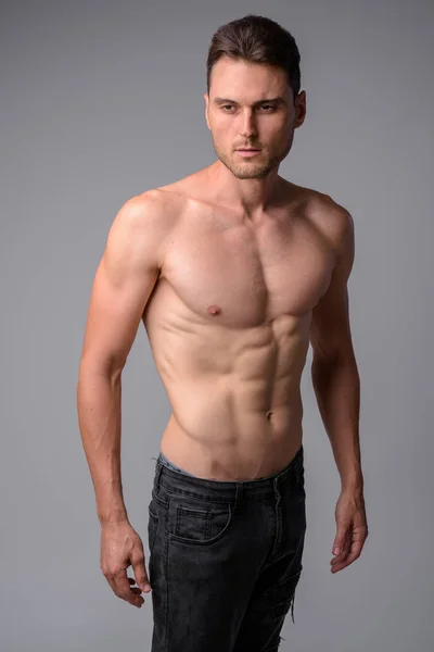 Studio shot of handsome muscular man shirtless — Stock Photo, Image