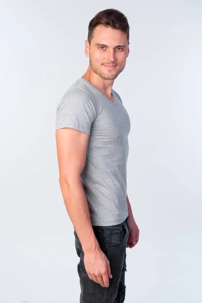 Studio shot of happy handsome man with casual clothing smiling — Stock Photo, Image