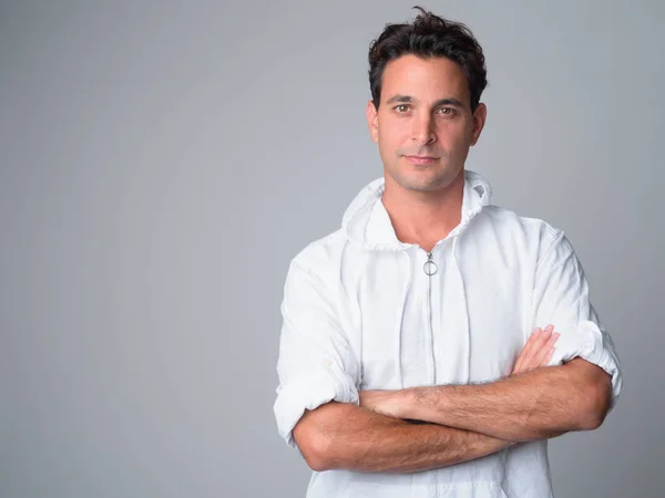 Portrait of handsome Hispanic man with arms crossed — Stock Photo, Image
