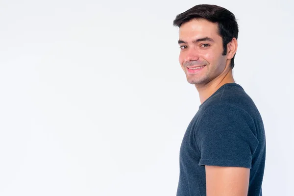 Closeup profile view of happy young handsome Persian man looking at camera — Stock Photo, Image