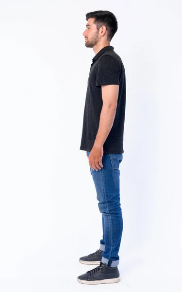 Full body shot profil vy över unga skäggiga Persiska man — Stockfoto