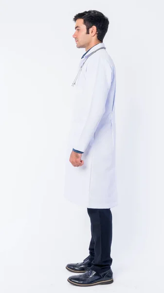 Full body shot profile view of young Persian man doctor — Stock Photo, Image