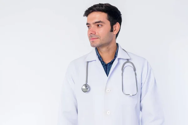 Face of young Persian man doctor thinking — Stock Photo, Image