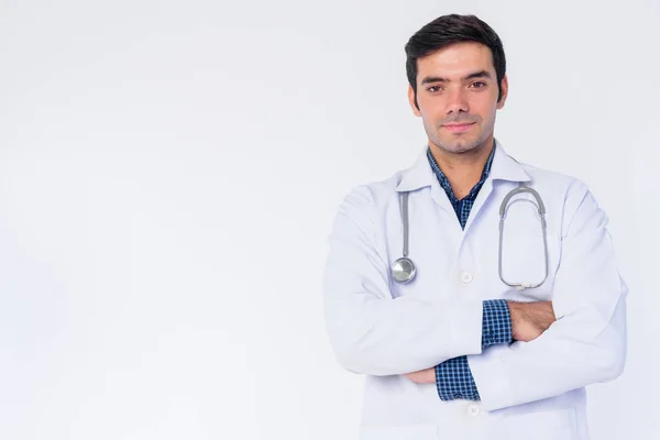 Portrait of young Persian man doctor with arms crossed — Stock Photo, Image